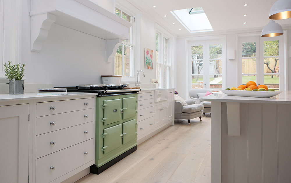 AGA 7 Series cooker in Olivine with white cabinetry 