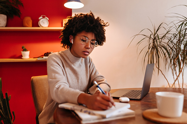 Girl with glasses studying