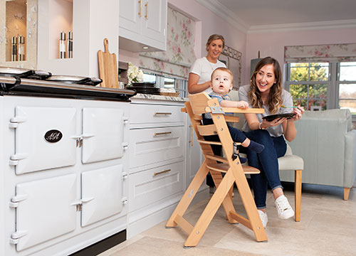 Lizzy with family in kitchen
