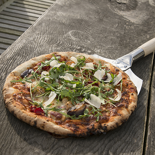 Pizza on the baking paddle