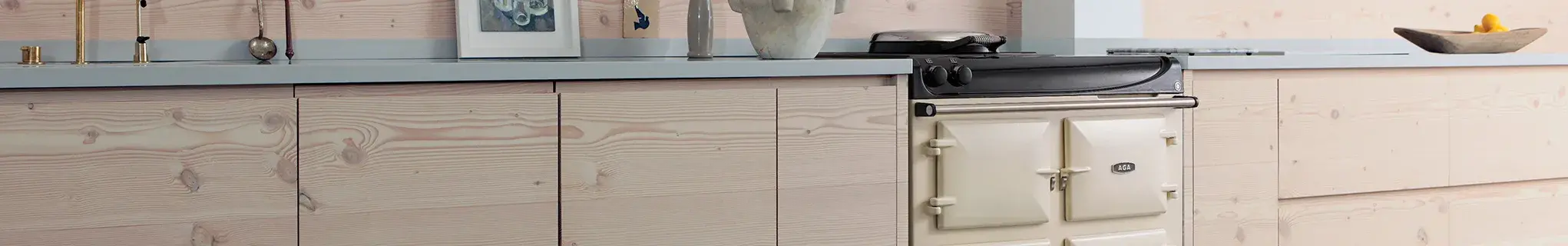 AGA eR3 Series 100 in Cream with wooden cabinetry 