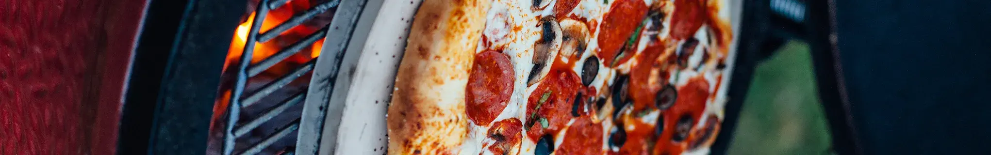 Pizza cooking on the Kamado Joe grill