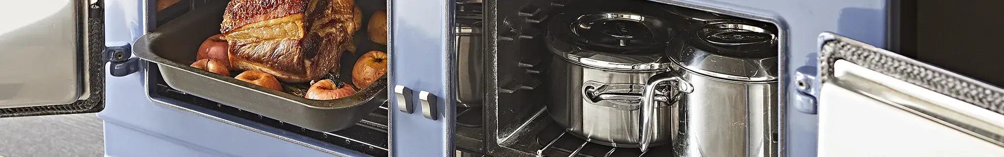AGA Cooker Collections in Dartmouth Blue with open oven doors 