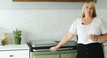 AGA Demonstrator Penny Zako with the Rayburn Ranger cooker in Olivine