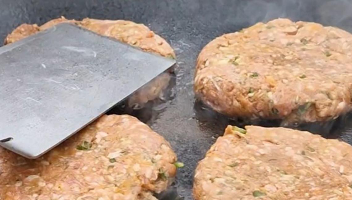 Lamb patties cooking on the AGA Outdoor Grill