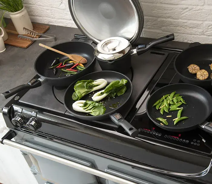 Cooking with pans on the AGA Induction Plate and hotplate